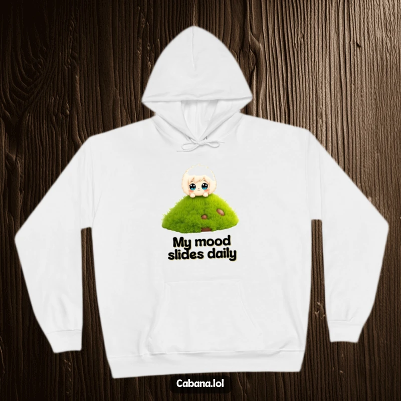 Funny hoodie featuring a fluffy character with wide eyes, gleefully sliding down a miniature grassy slide.